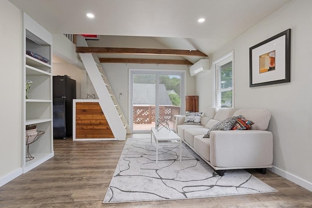 12 Temple Ave, Hudson, MA 01749 - living area featuring a wall mounted AC, wood finished floors, stairway, baseboards, and recessed lighting