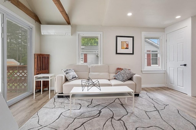 12 Temple Ave, Hudson, MA 01749 - living room featuring a wall mounted AC, light wood-style floors, recessed lighting, and baseboards