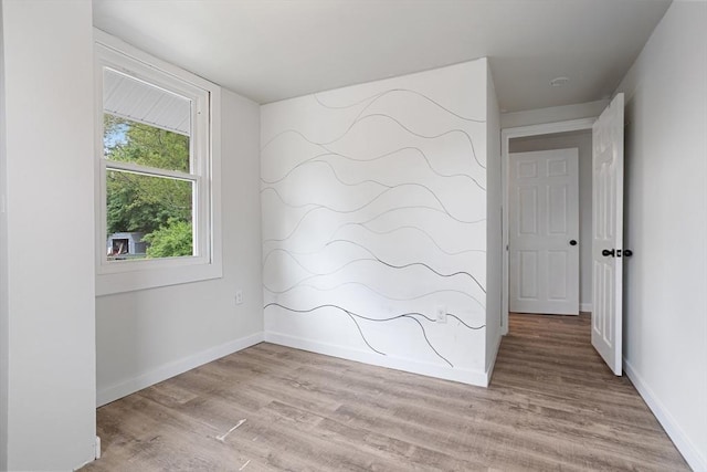 12 Temple Ave, Hudson, MA 01749 - empty room with light wood-style flooring and baseboards