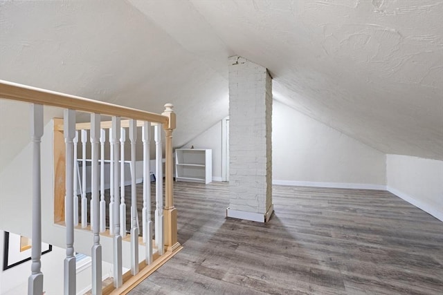 12 Temple Ave, Hudson, MA 01749 - additional living space with lofted ceiling, wood finished floors, and baseboards