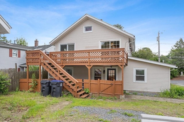 12 Temple Ave, Hudson, MA 01749 - rear view of house with a wooden deck and stairs
