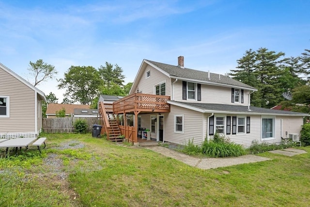 12 Temple Ave, Hudson, MA 01749 - back of property with stairway, a deck, and a chimney