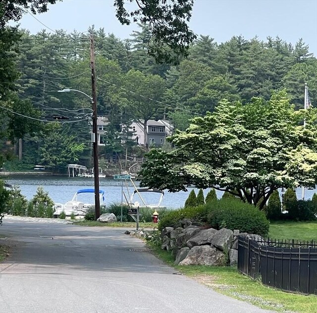 12 Temple Ave, Hudson, MA 01749 - view of asphalt street with street lighting and a wooded view
