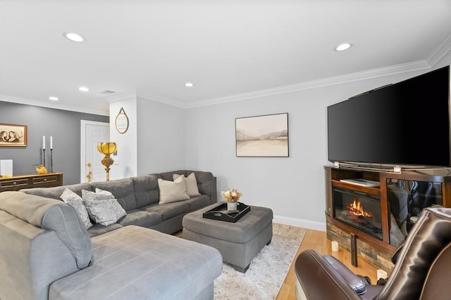 21 Starr Dr Unit 207, Narragansett, RI 02882 - living room featuring light wood-style flooring, recessed lighting, crown molding, and a glass covered fireplace
