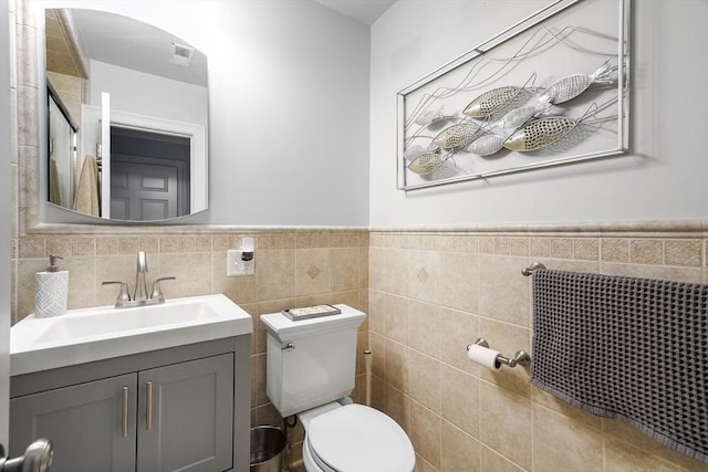 21 Starr Dr Unit 207, Narragansett, RI 02882 - bathroom featuring vanity, wainscoting, and tile walls