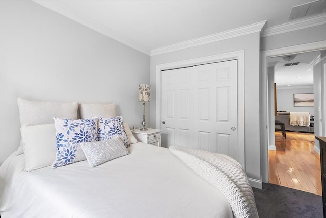 21 Starr Dr Unit 207, Narragansett, RI 02882 - bedroom featuring a closet, crown molding, and carpet floors