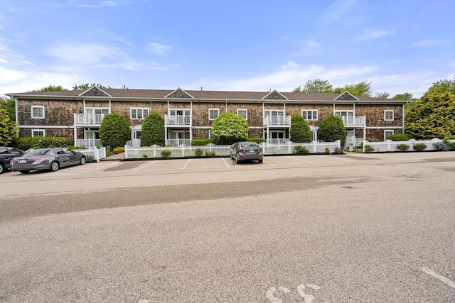 21 Starr Dr Unit 207, Narragansett, RI 02882 - view of front of home featuring uncovered parking and brick siding