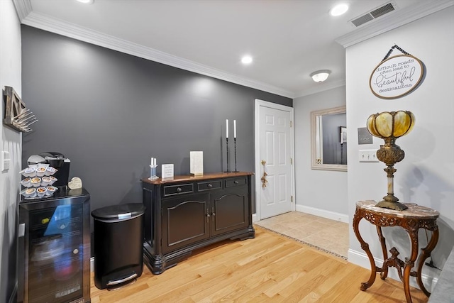 21 Starr Dr Unit 207, Narragansett, RI 02882 - entrance foyer with light wood-style floors, ornamental molding, and recessed lighting
