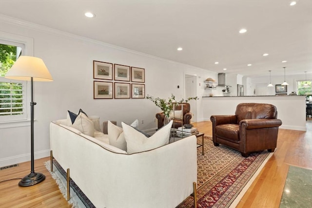 1 Bridge Ln, Newburyport, MA 01950 - living room with wood finished floors, ornamental molding, and recessed lighting