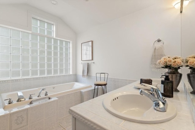 1 Bridge Ln, Newburyport, MA 01950 - bathroom featuring a garden tub, vaulted ceiling, tile patterned flooring, and double vanity