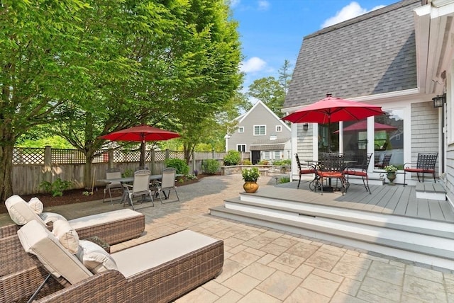 1 Bridge Ln, Newburyport, MA 01950 - fenced backyard featuring outdoor dining space, a patio area, outdoor lounge area, and a deck