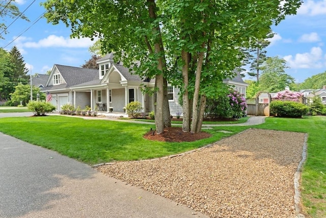 1 Bridge Ln, Newburyport, MA 01950 - view of front of house featuring a porch, a garage, concrete driveway, and a shingled roof