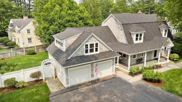 1 Bridge Ln, Newburyport, MA 01950 - shingle-style home featuring roof with shingles, asphalt driveway, a porch, a gambrel roof, and view of wooded area