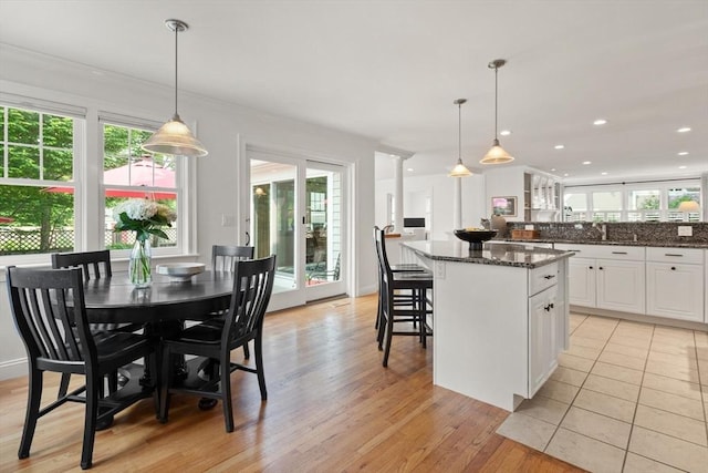 1 Bridge Ln, Newburyport, MA 01950 - kitchen with a center island, plenty of natural light, white cabinetry, dark stone counters, and recessed lighting