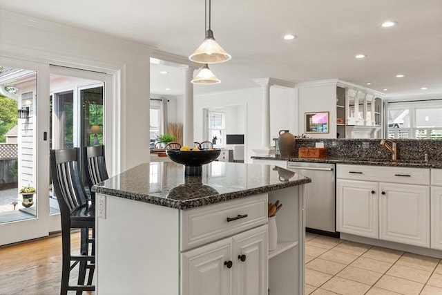 1 Bridge Ln, Newburyport, MA 01950 - kitchen featuring dishwasher, white cabinetry, pendant lighting, ornamental molding, and a kitchen island