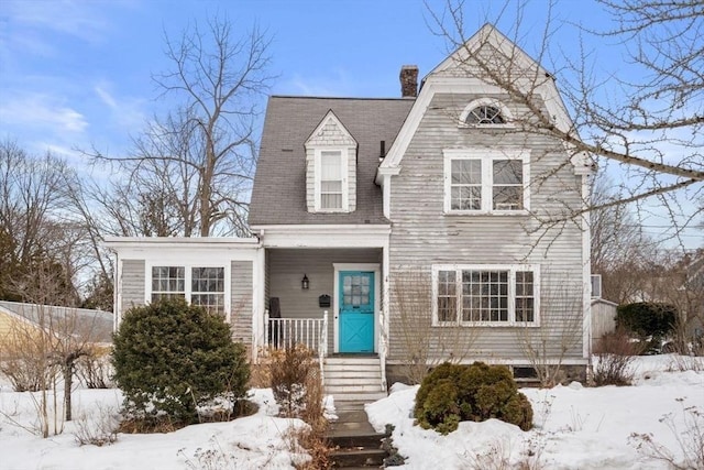 shingle-style home with a chimney