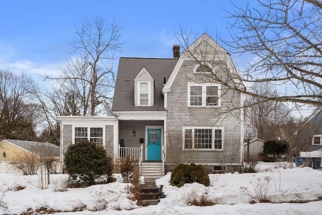 view of front of property with a chimney