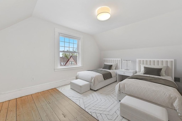 69 Dracut, Boston, MA 02124 - bedroom featuring lofted ceiling and wood-type flooring