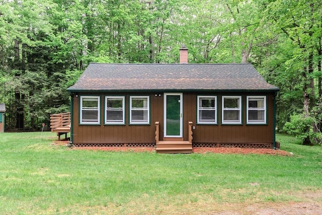 32 Birch Rd, Goshen, MA 01032 - view of front of property featuring entry steps, a shingled roof, a chimney, and a front lawn