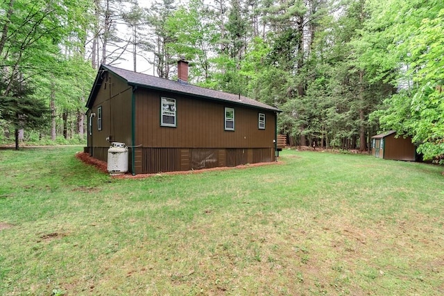 32 Birch Rd, Goshen, MA 01032 - view of home's exterior with a chimney and a yard