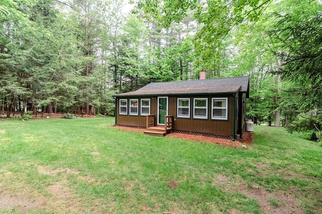32 Birch Rd, Goshen, MA 01032 - view of front of property with a chimney, a front yard, and a shingled roof
