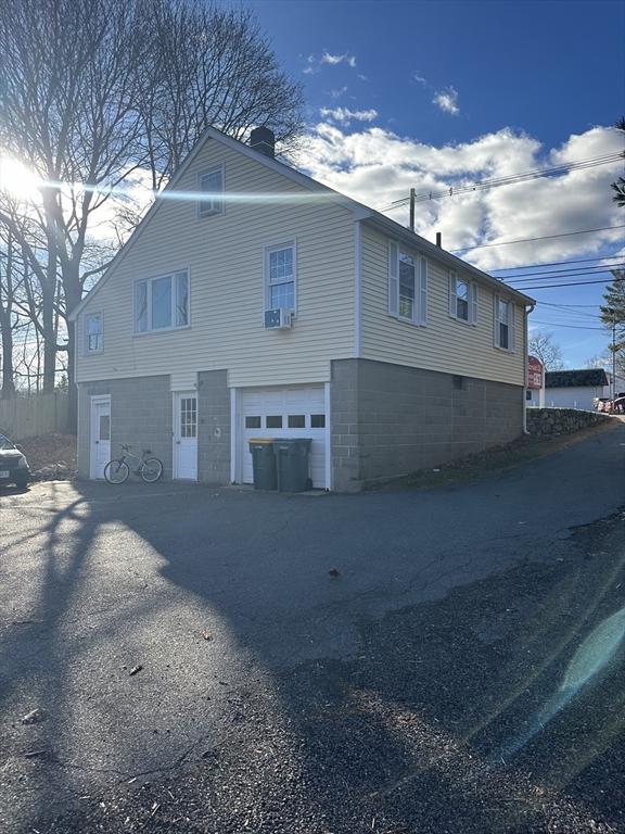 view of side of property featuring a garage