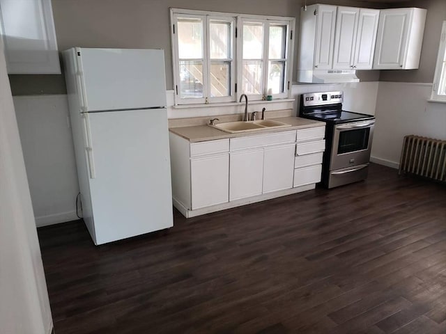 kitchen featuring radiator, white refrigerator, sink, stainless steel electric range oven, and white cabinetry