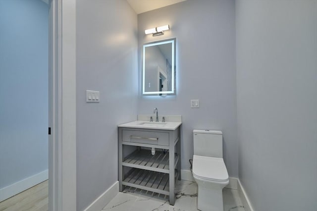 97 Oakton Ave, Boston, MA 02122 - bathroom featuring baseboards, toilet, vanity, and marble look tile flooring