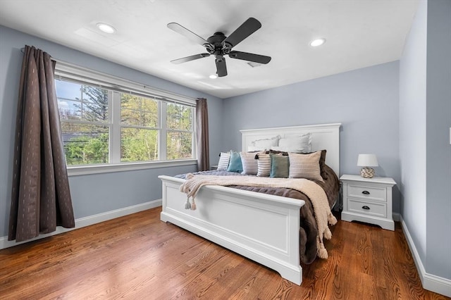 bedroom featuring wood finished floors, baseboards, a ceiling fan, and recessed lighting
