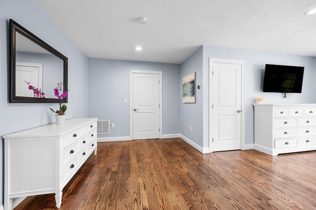 hall featuring baseboards, dark wood-style flooring, recessed lighting, and visible vents
