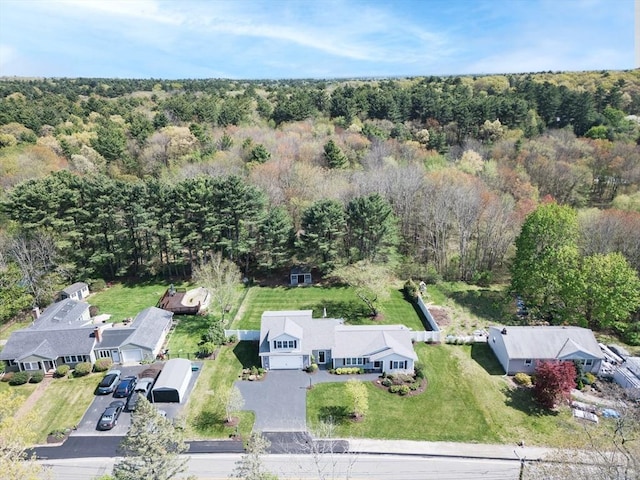 drone / aerial view featuring a forest view