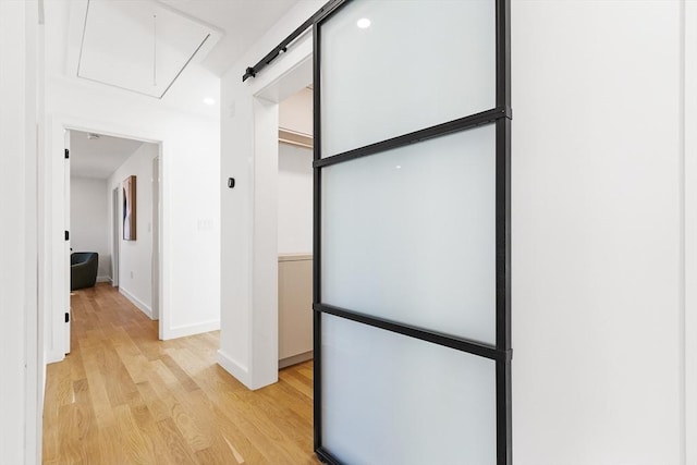 corridor with light wood-type flooring