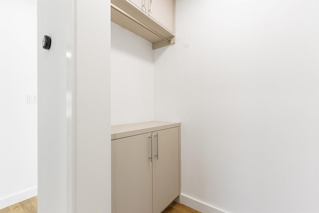 spacious closet featuring light hardwood / wood-style floors