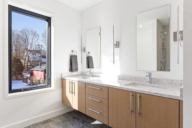 bathroom with walk in shower and vanity