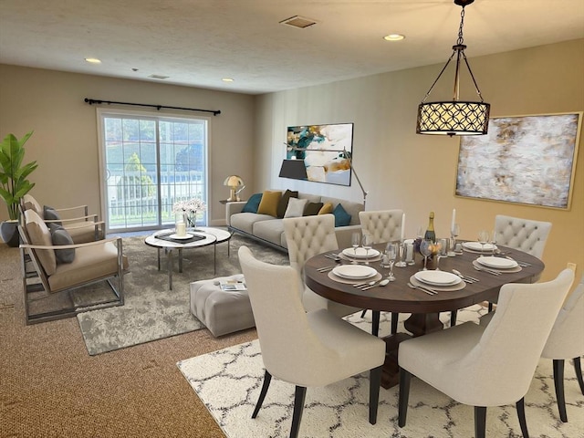 dining room featuring carpet floors and recessed lighting