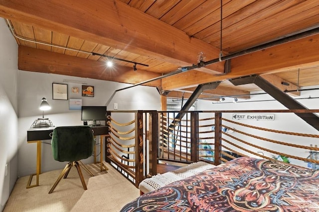 carpeted bedroom featuring wooden ceiling and track lighting