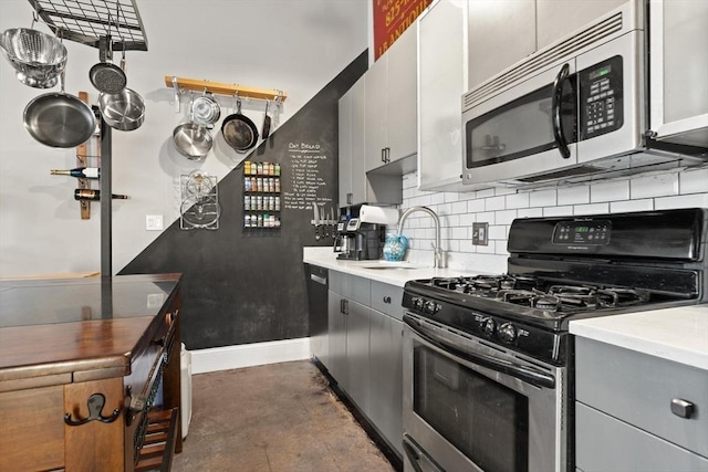 kitchen with gray cabinets, sink, white cabinetry, and stainless steel appliances