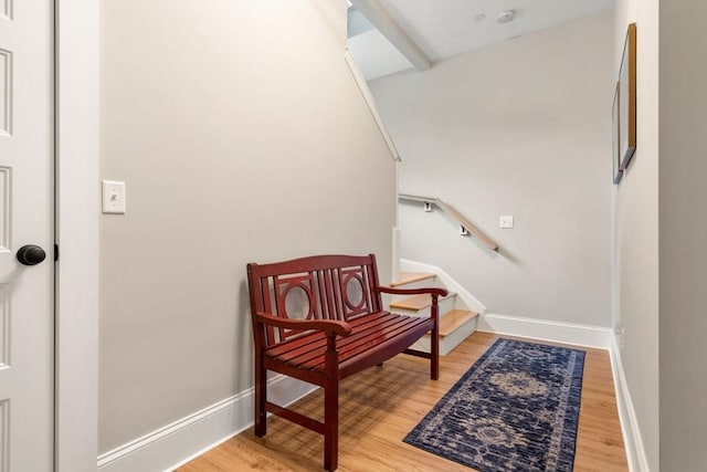 living area with wood finished floors and baseboards