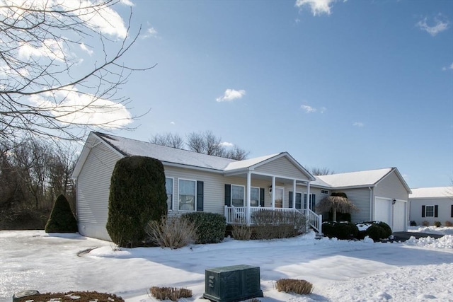 view of front of property featuring covered porch and a garage