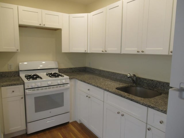 kitchen with sink, white cabinetry, and gas range gas stove