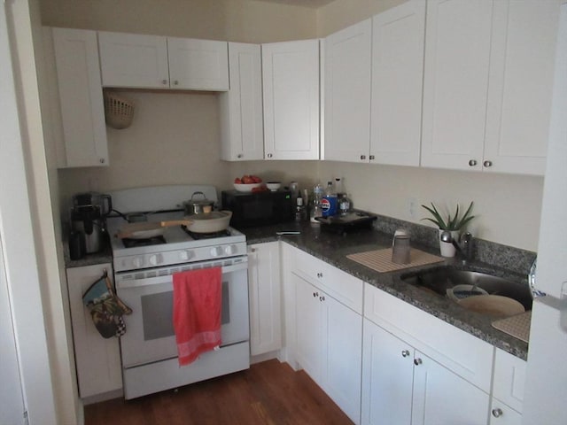 kitchen featuring sink, white cabinetry, white range with gas stovetop, and dark hardwood / wood-style floors