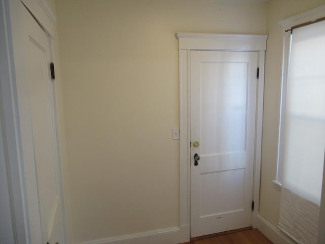 entryway with hardwood / wood-style flooring