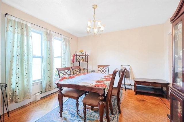 dining space featuring light parquet floors, plenty of natural light, and a notable chandelier