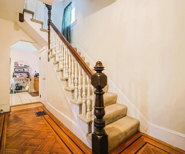 stairs with parquet floors