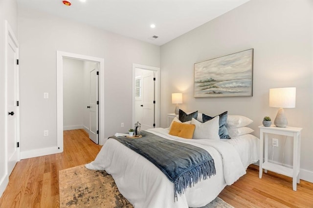 21 Ellington St Unit 2, Boston, MA 02121 - bedroom with light wood-style flooring, baseboards, and a spacious closet