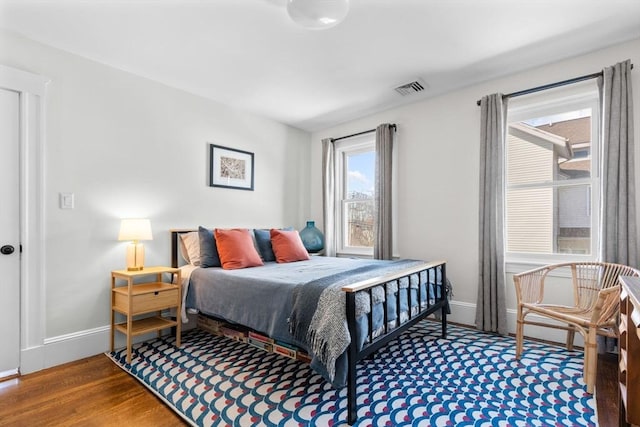 149-151 Pleasant St, Watertown, MA 02472 - bedroom with wood finished floors and baseboards