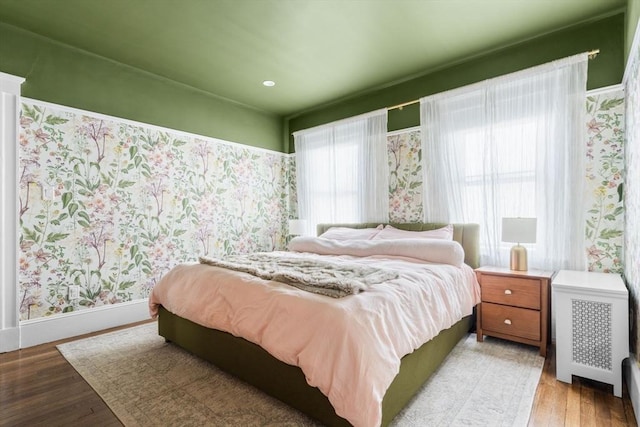 149-151 Pleasant St, Watertown, MA 02472 - bedroom featuring light wood-style floors, baseboards, and wallpapered walls