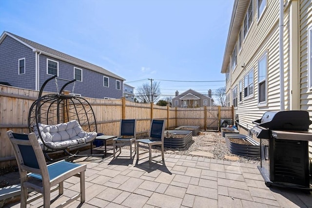 149-151 Pleasant St, Watertown, MA 02472 - fenced backyard with a patio area and grilling area