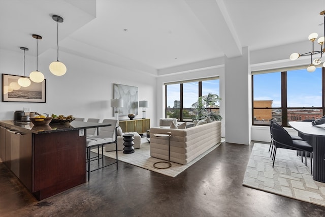 living room featuring a notable chandelier