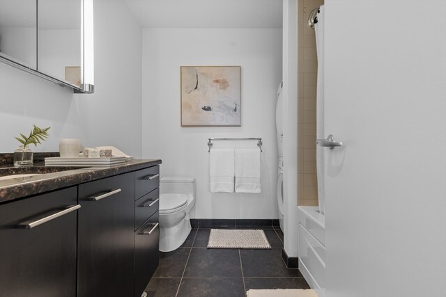 full bathroom with vanity, toilet, shower / bath combo, and tile patterned flooring